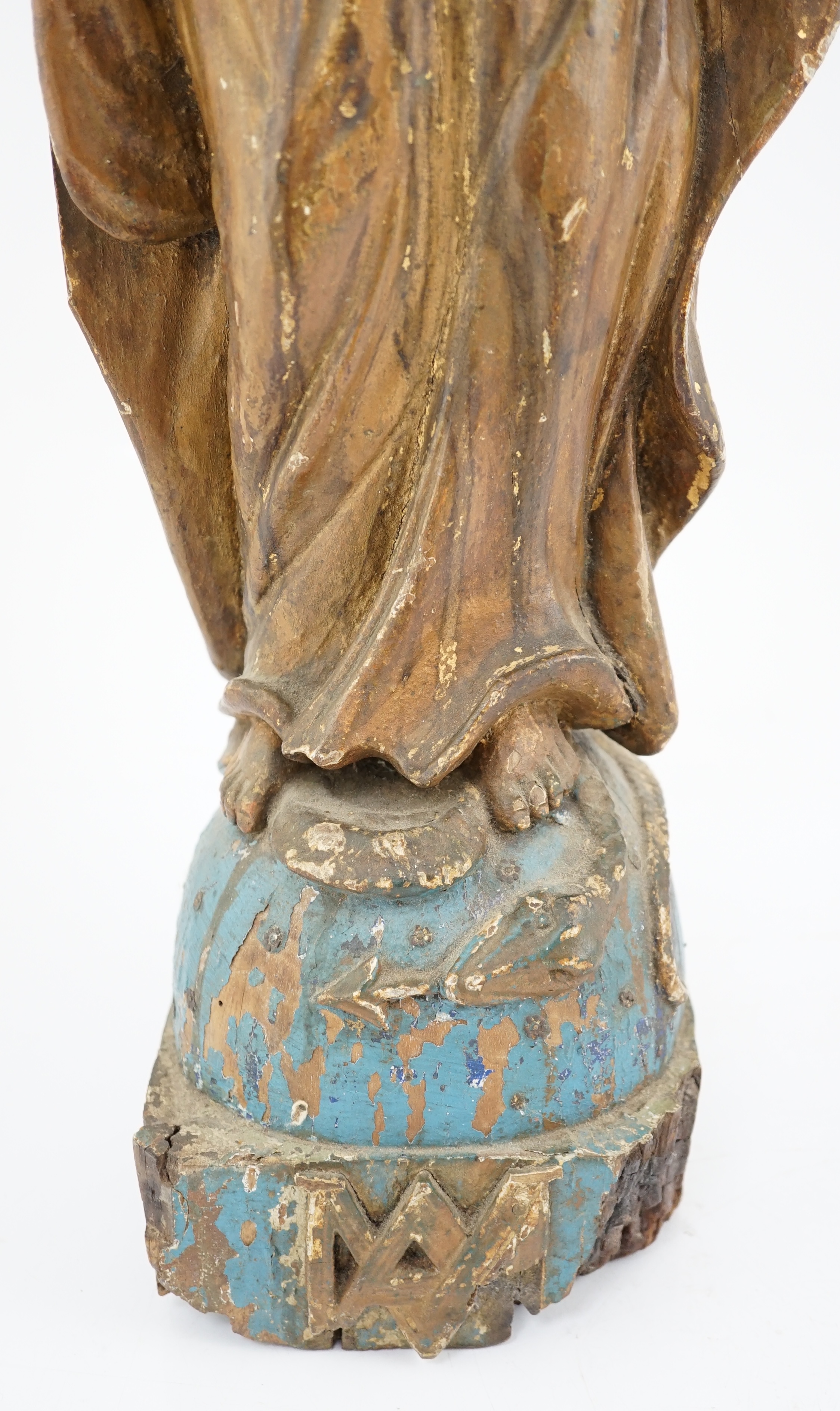 An 18th century Continental carved wood figure of a female saint